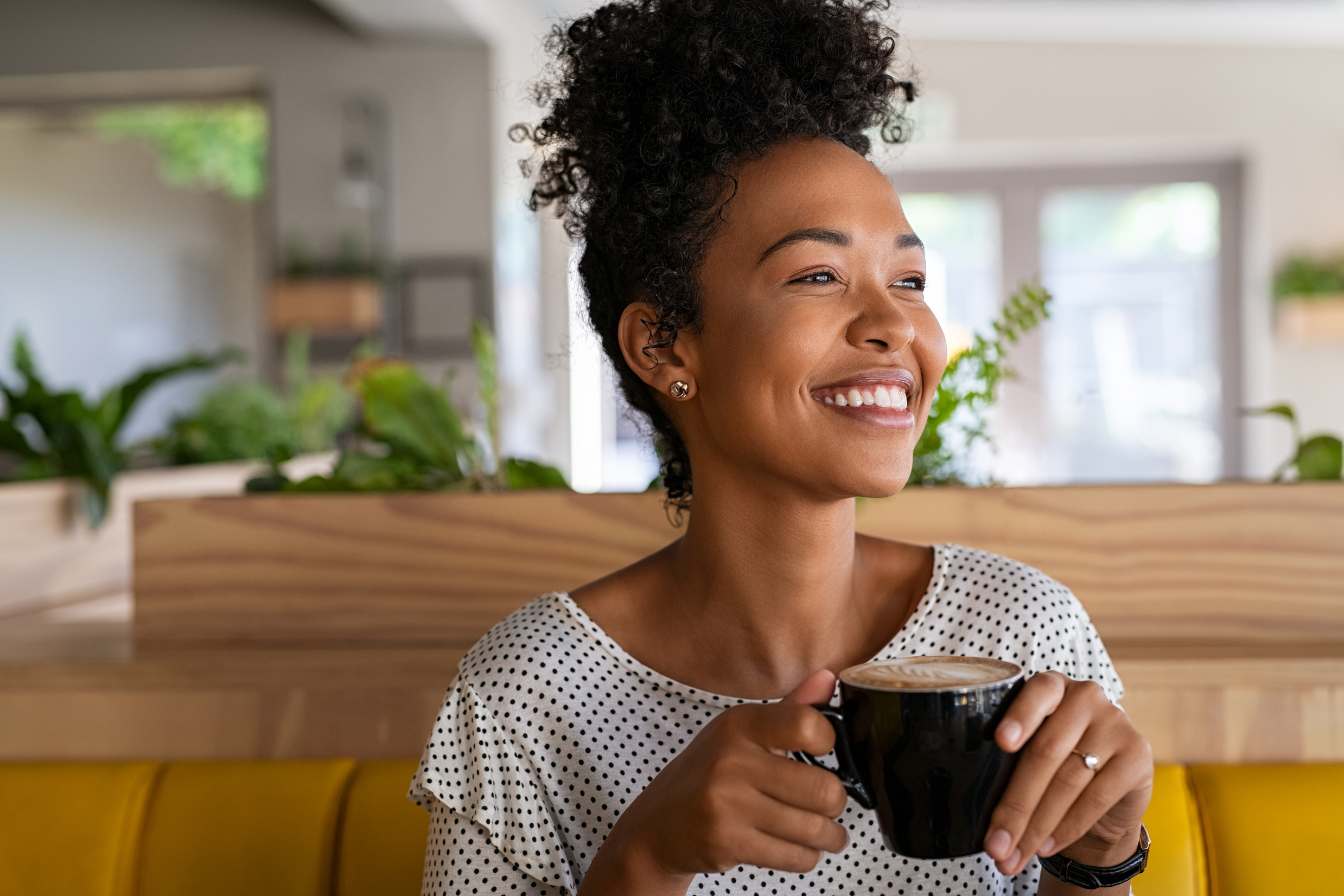Beautiful Black Girl Drinking Coffee at Cafe